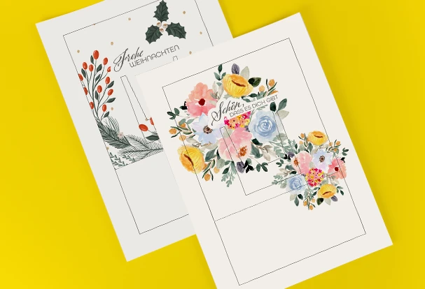 Zwei Designbögen mit liebevollen Botschaften. Einer mit weihnachtlichem Design und 'Frohe Weihnachten', der andere mit sommerlichen Blumen und 'Schön, dass es dich gibt'