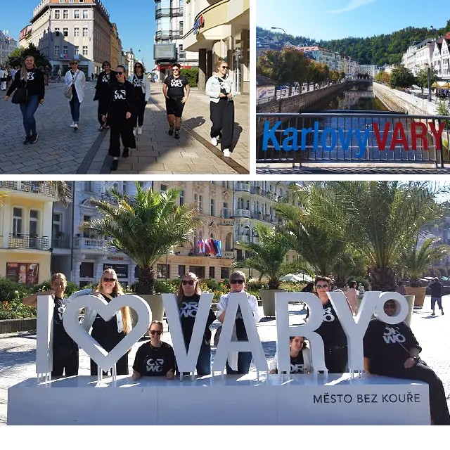 Eine Gruppe von Menschen in ORWO-Shirts in Karlovy Vary, Tschechien, mit Wahrzeichen und Stadtlandschaft. Das ORWO-Marketingteam in Karlovy Vary