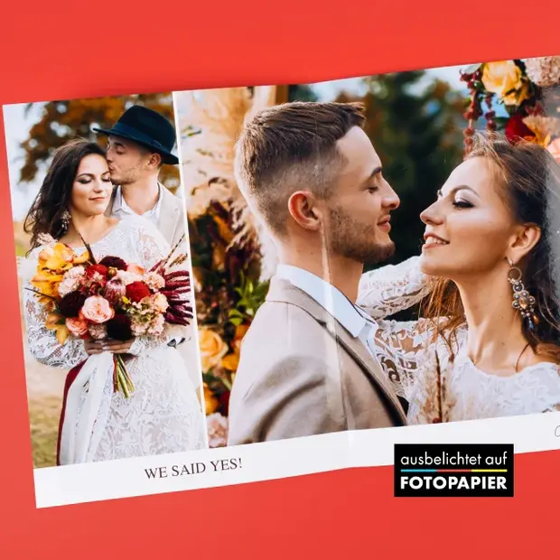 Hochzeitsfotobuch auf Fotopapier mit großformatigen Bildern eines Brautpaars und hochwertigem Druck