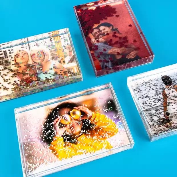Neue Produkte – bunte Schüttelrahmen mit Fotos und Glitzereffekten, ideal als personalisierte Deko oder Geschenkidee für besondere Erinnerungen.