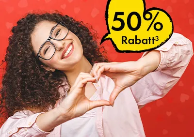 ORWO Fotoprodukte zum Valentinstag mit 50 Prozent Rabatt, Frau formt Herz mit den Händen vor rotem Hintergrund