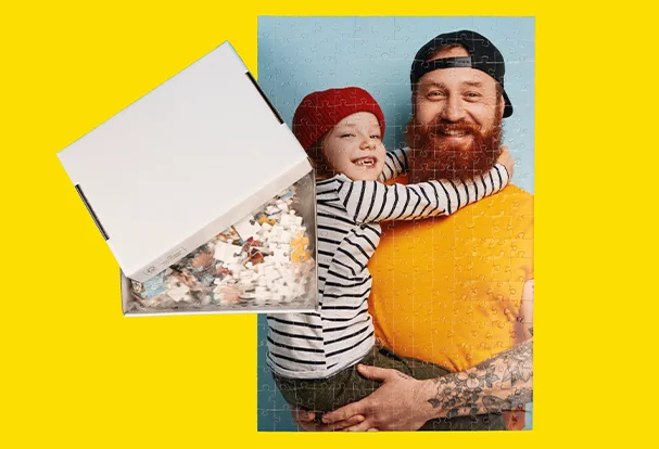 Fotopuzzle auf Karton – 266 Teile voller Erinnerungen Puzzle mit 266 Teilen, zeigt Papa mit Kind auf dem Arm. Weiße Verpackung mit individuellem Fotodruck.